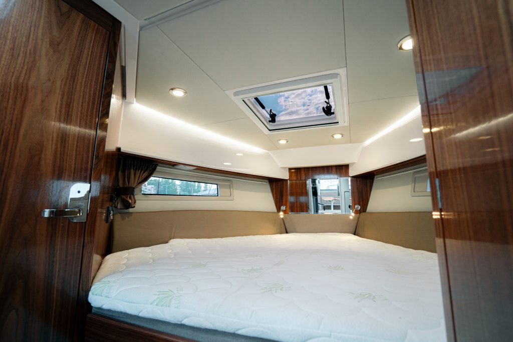 Forward cabin of the Aquador 250 HT with a double berth