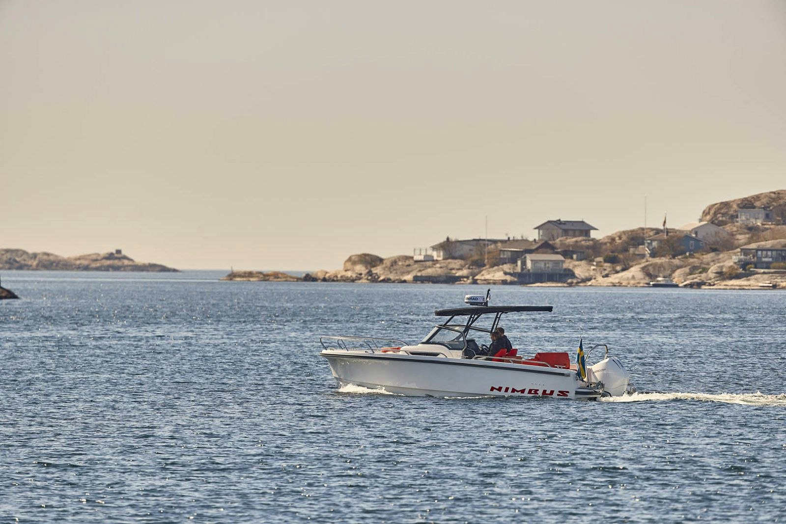 Boat anchored off a Boston Harbor island on a clear day