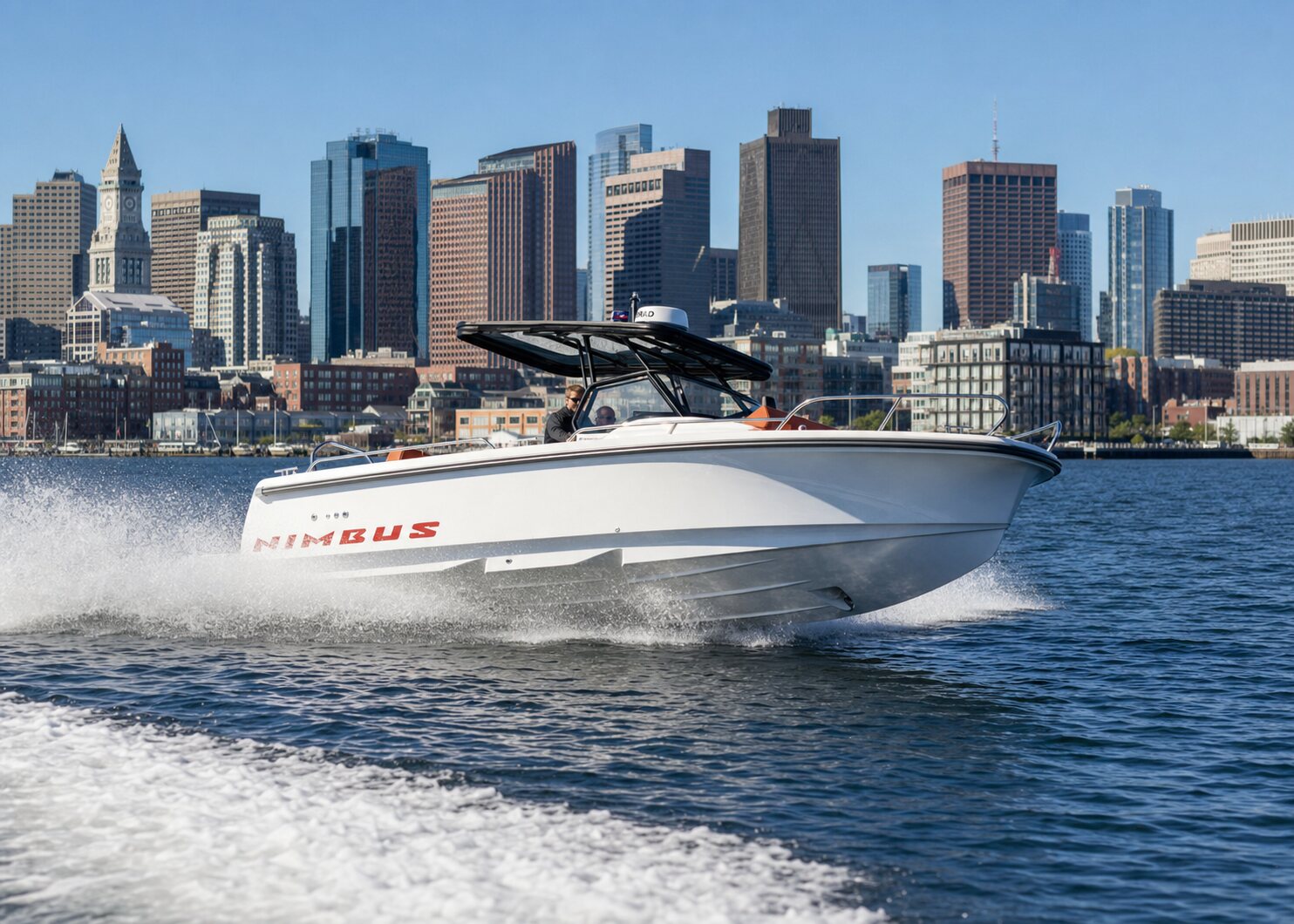 Boat cruising Boston Harbor with the skyline behind