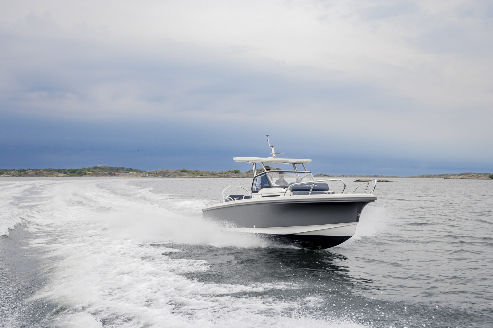 Nimbus T8 running up the coast on a grey day